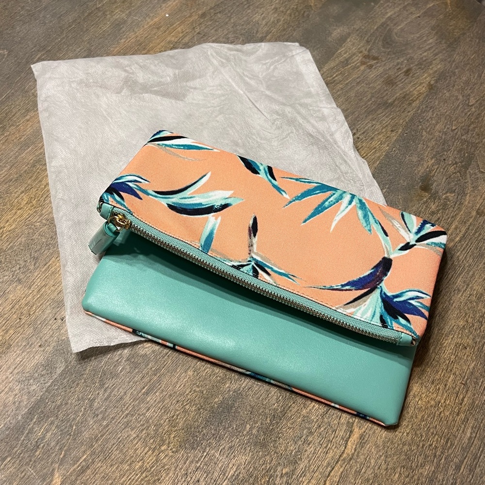 Brand-new reversible light blue and tropical print clutch